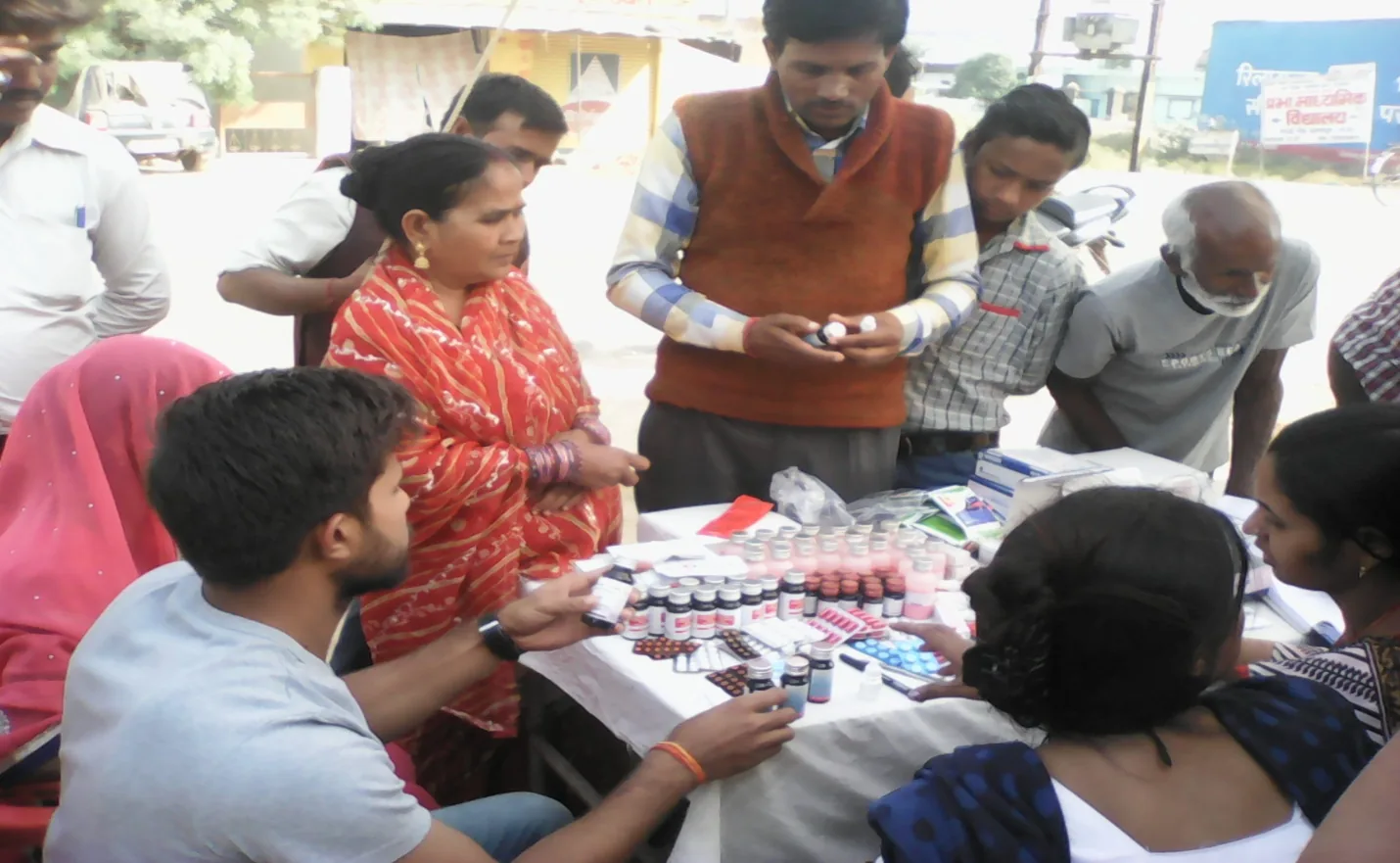 Community members engaging with a Sumitra health outreach team